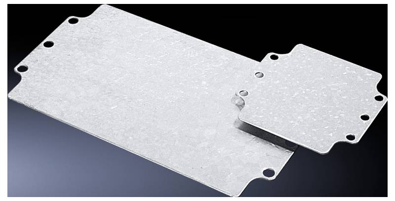 Two silver metal plates with hole drillings at the corners, positioned against a black background. One larger and one smaller plate.