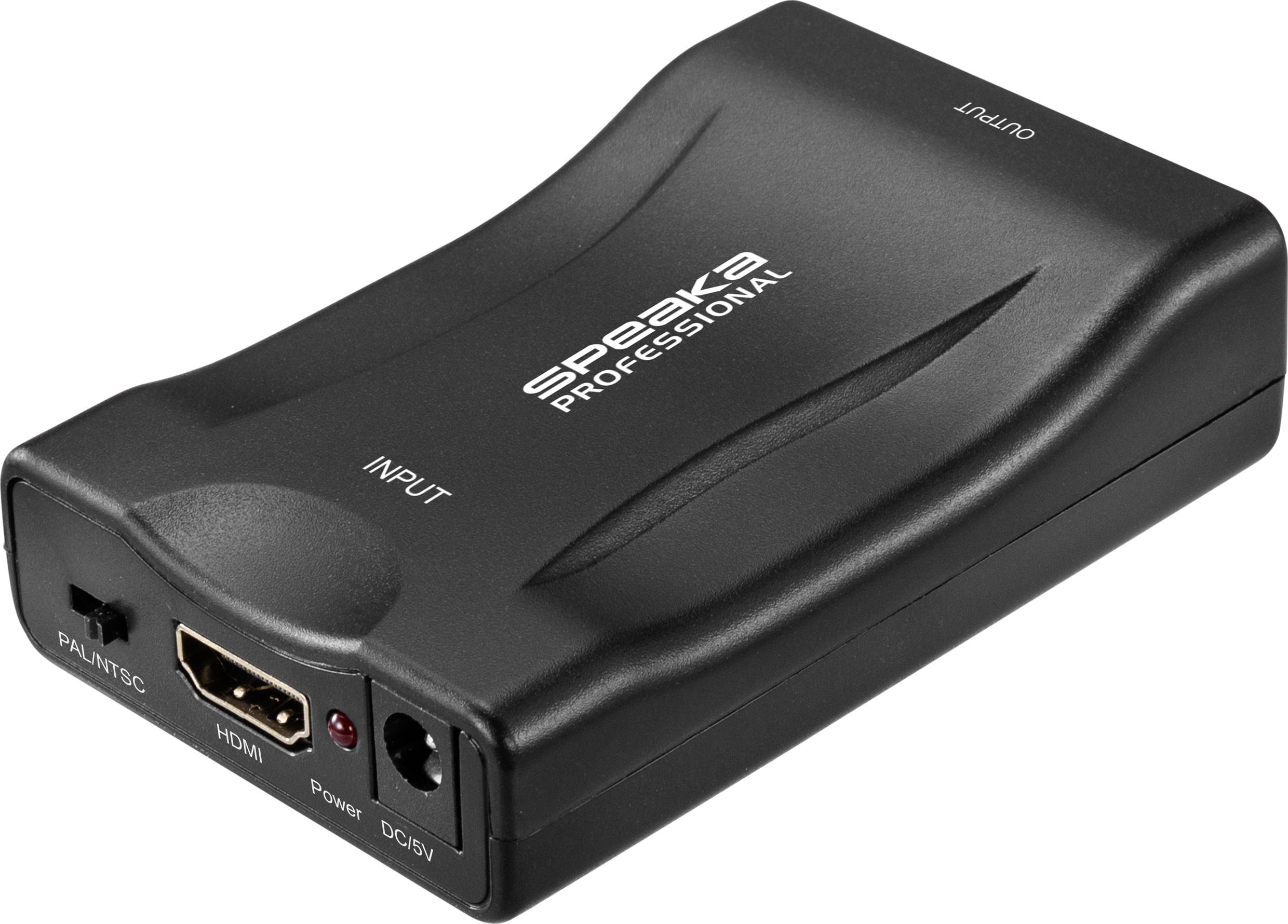 'SPEAKA' HDMI converter, black, with connections for PAL/NTSC, HDMI, Power, DC/5V, Input, Output. Piece of furniture in the background not in focus.