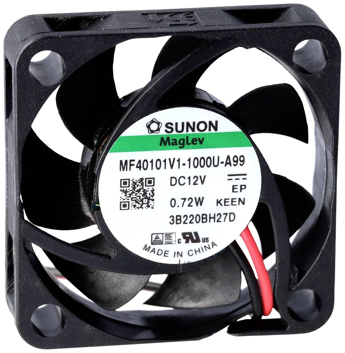 Computer fan with five black rotor blades and a sticker displaying technical specifications, including voltage 12V, power 0.72W.