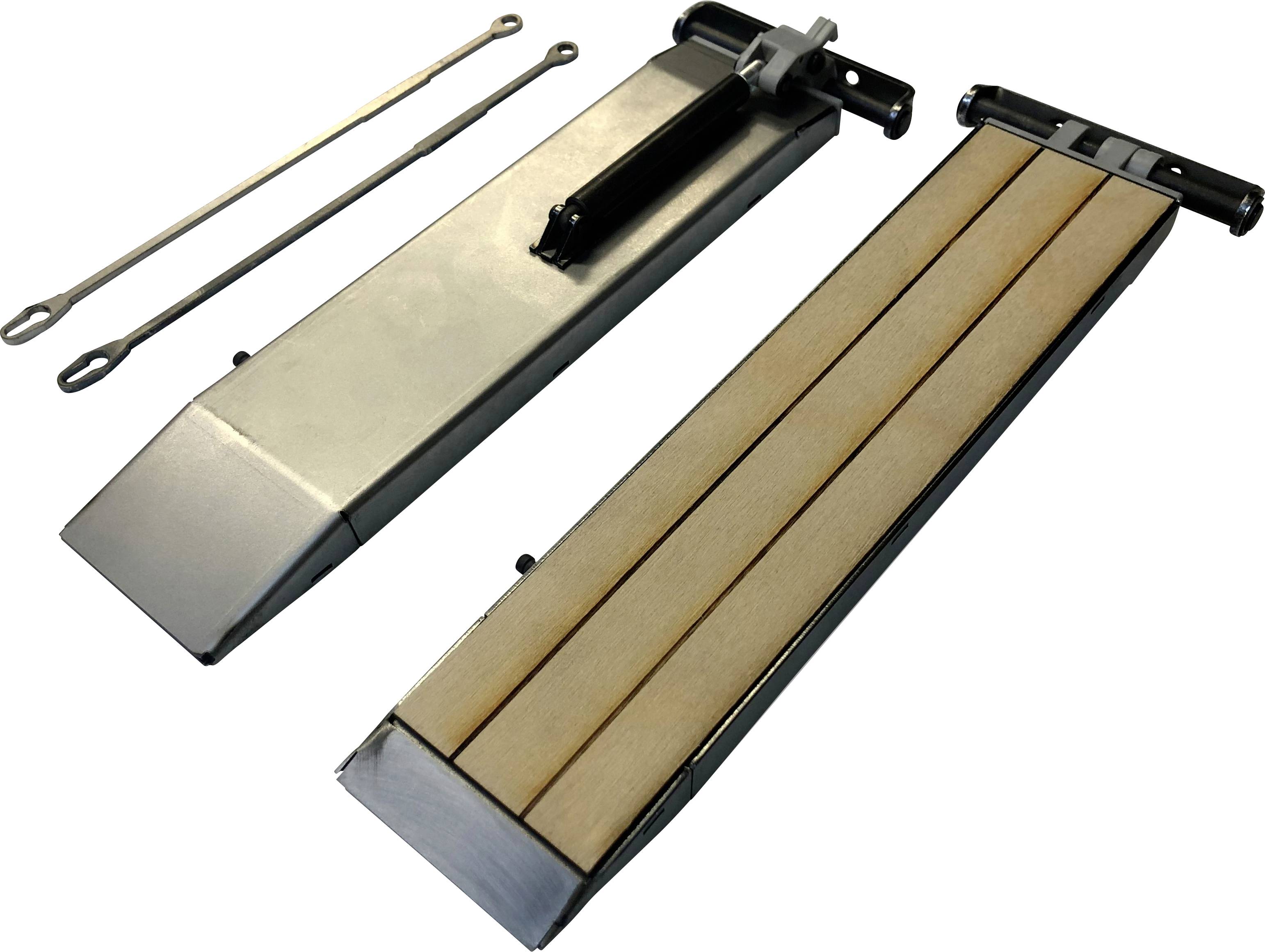 Two silver wedges with wooden elements and rings, presumably for vehicles. On the left, two rods with eyelets, on the right wedges in resting position.