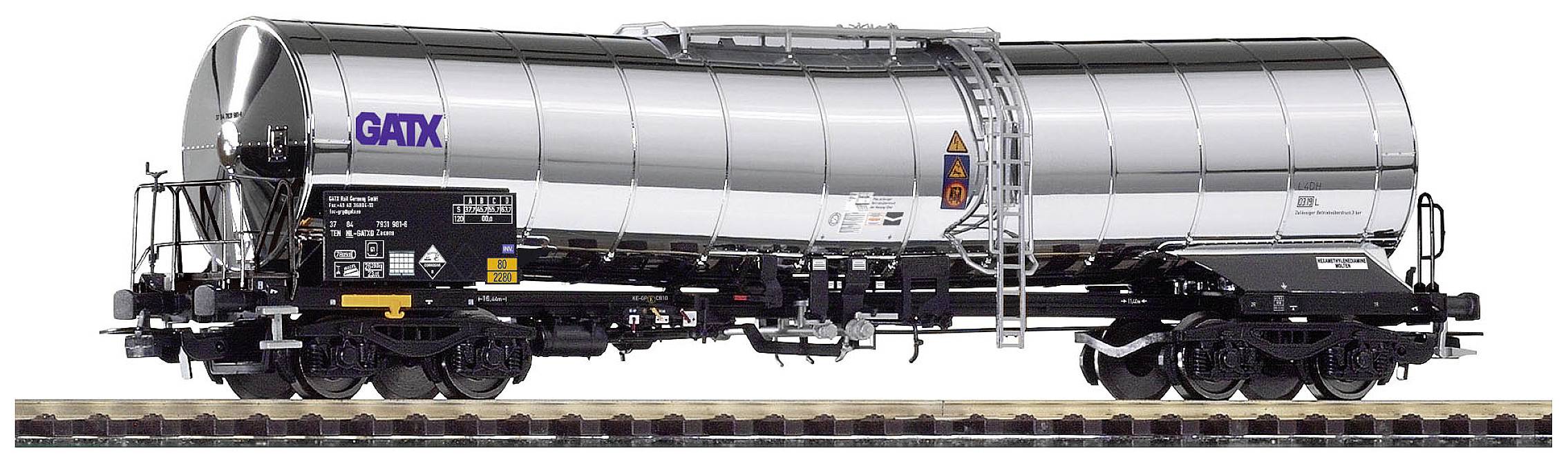 A silver tank wagon from the GATX company on railway tracks, with hazardous goods markings and technical details on the side.