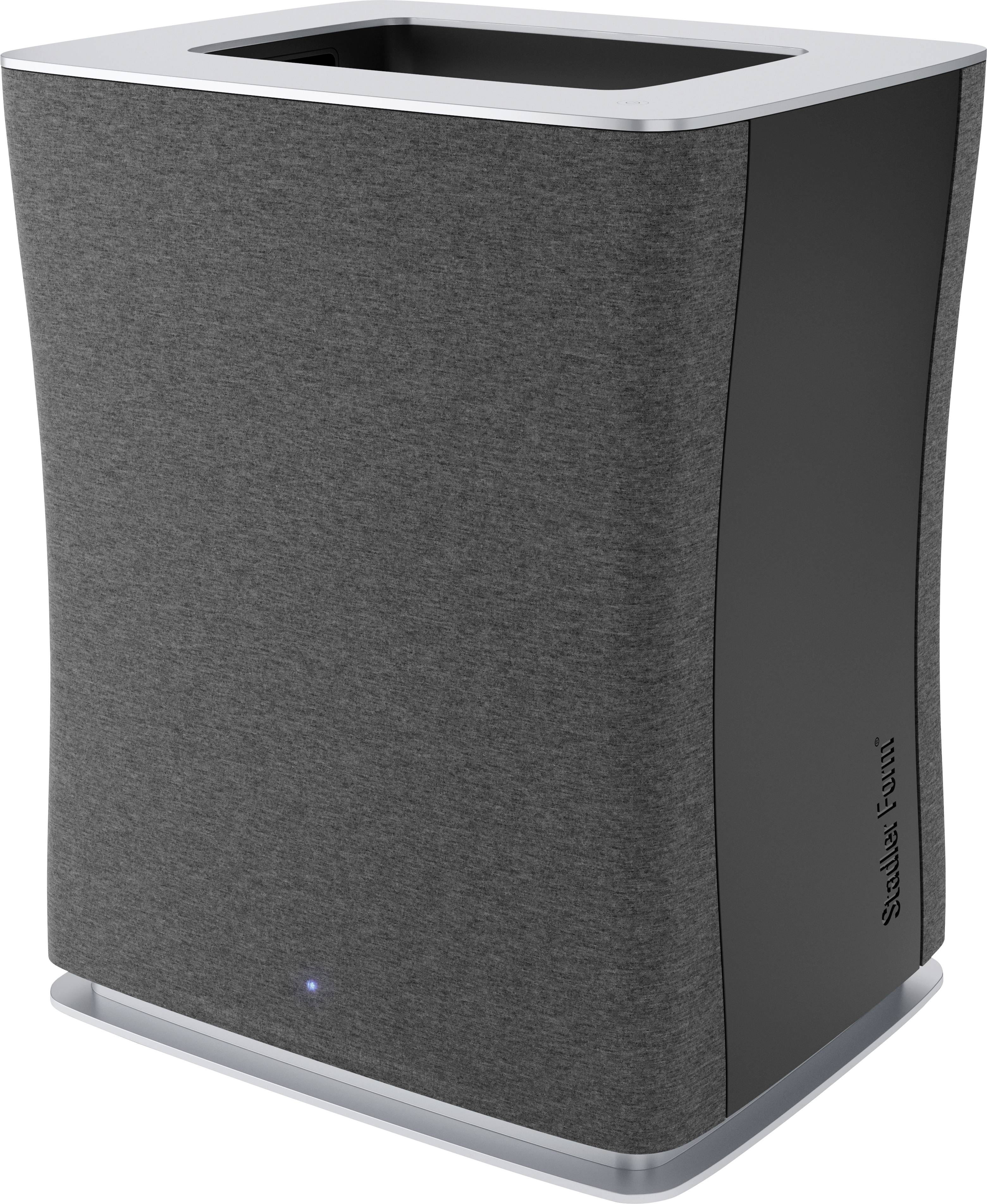 Air purifier with a grey fabric cover and digital display on the right side, standing on a white surface.