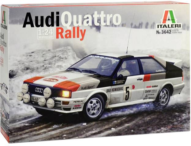 A model car kit depicts an Audi Quattro rally sports car on a snow-covered track. Prominent brand markings and race number 5.