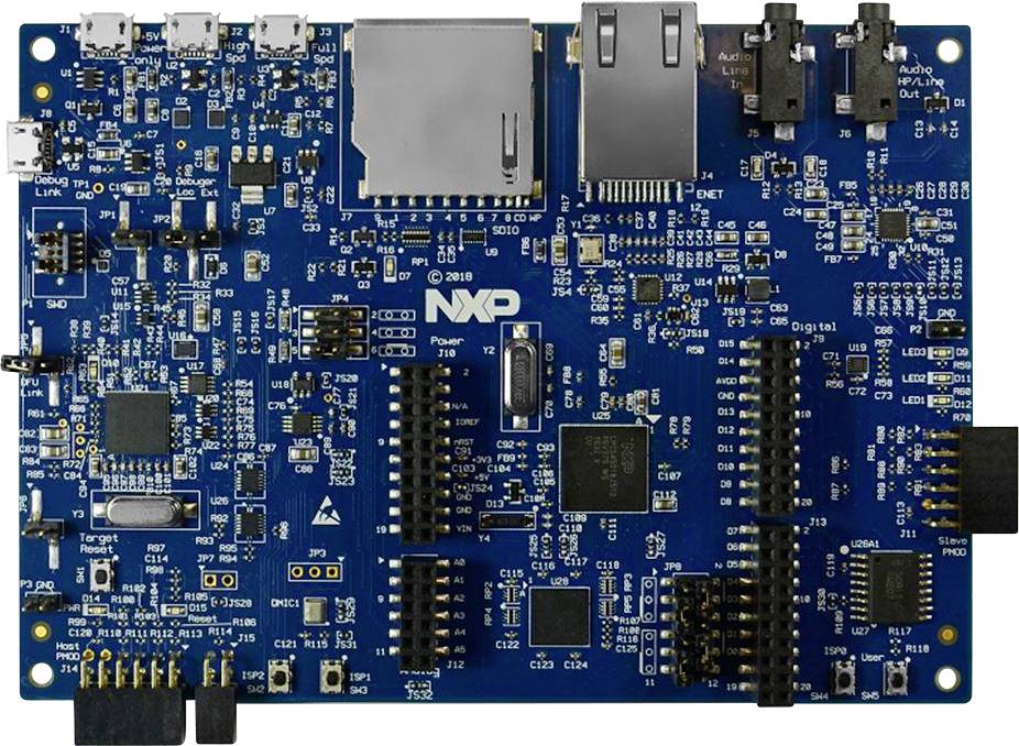 A blue circuit board with various electronic components and ports, including USB ports, audio connectors, and an Ethernet port.