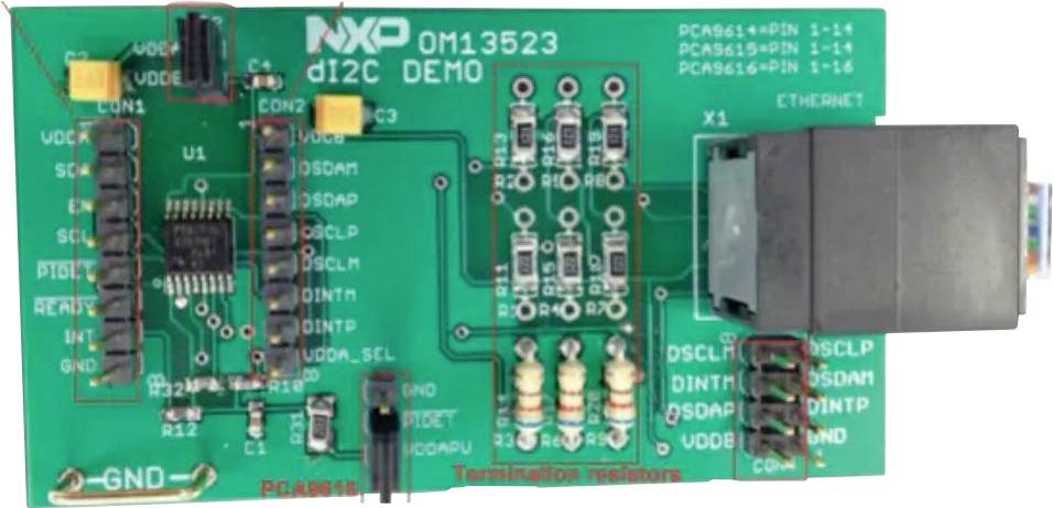 A green electronic circuit board with the inscription 'NXP OM13523 di2C DEMO', featuring multiple chips, resistors, and Ethernet connectivity ports.