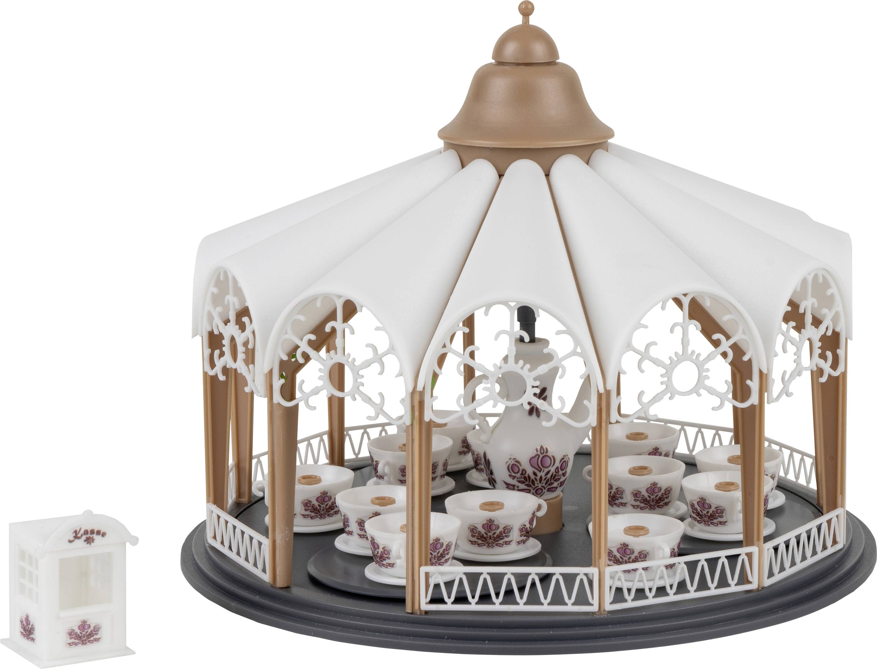 A miniature carousel in the style of teacup rides, with a candelabra on it, stands beside a small ticket booth.