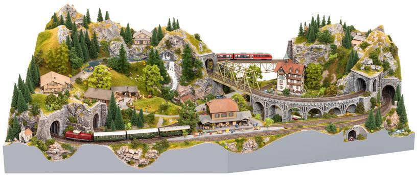 Model railway scene with trains travelling over a bridge and through tunnels, surrounded by miniature mountains, houses, and trees.