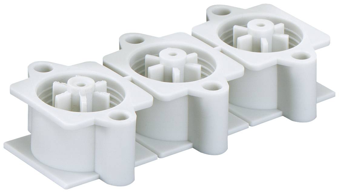 Three white plastic inserts in a row; each with gear-like structures. Used for industrial applications.