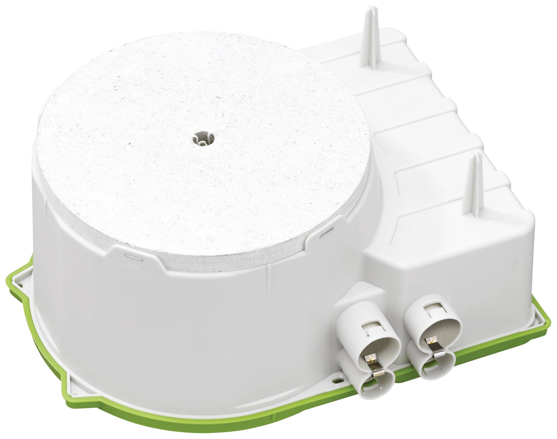 A white, round electrical component with two connectors on the side, mounted on a green base.