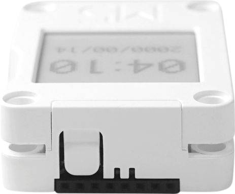 A small, rectangular electronic device with a display shows '04:10' and a date. It has a connection port on its underside.