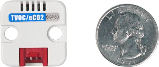 A sensor labelled 'TVOC/eCO2 SGP30' positioned next to a US quarter coin from 1992 to illustrate its size.