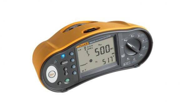 An orange electrical testing device with a digital display shows a resistance of 500 ohms. It has buttons for various functions.