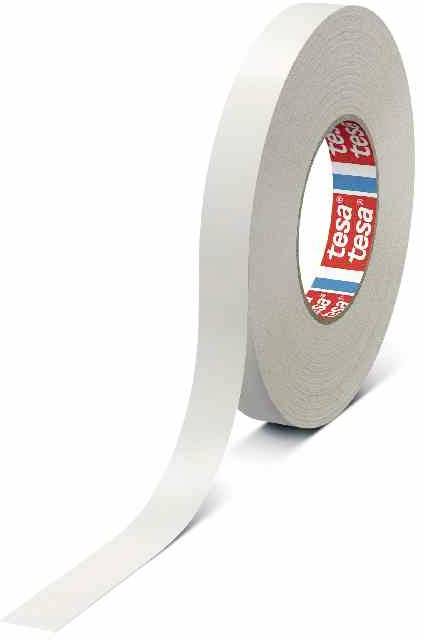 A roll of white double-sided adhesive tape by tesa. One end of the tape is slightly peeled back to reveal the adhesive surface.