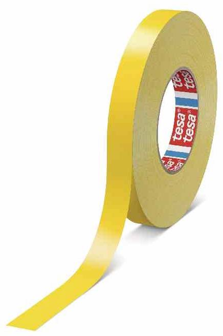 Yellow adhesive tape with the inscription tesa, unrolled. It shows the logo on the inside of the roll. Suitable for packaging.