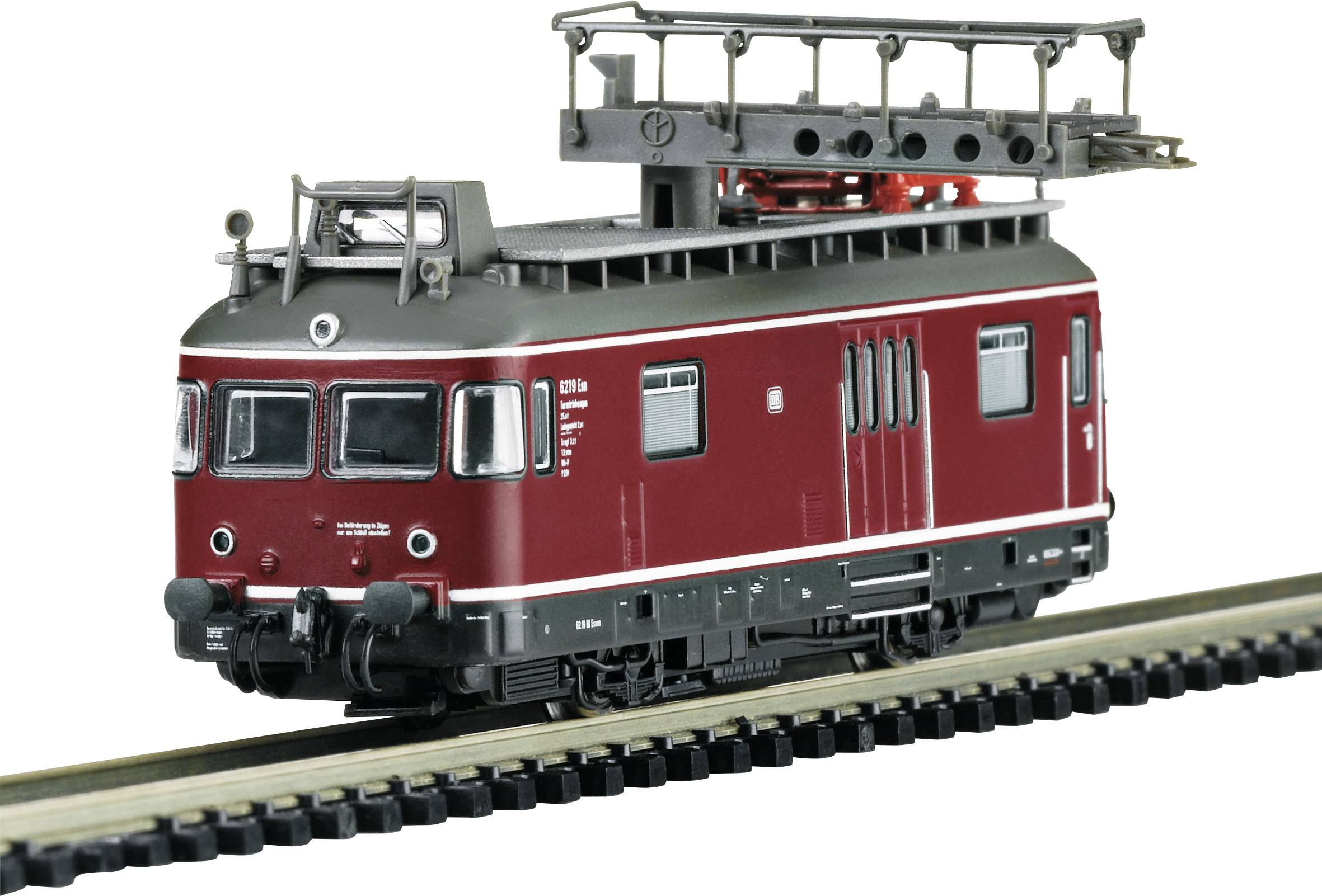 A red model of an electric locomotive with overhead line, meticulously recreated, stands on a piece of track.