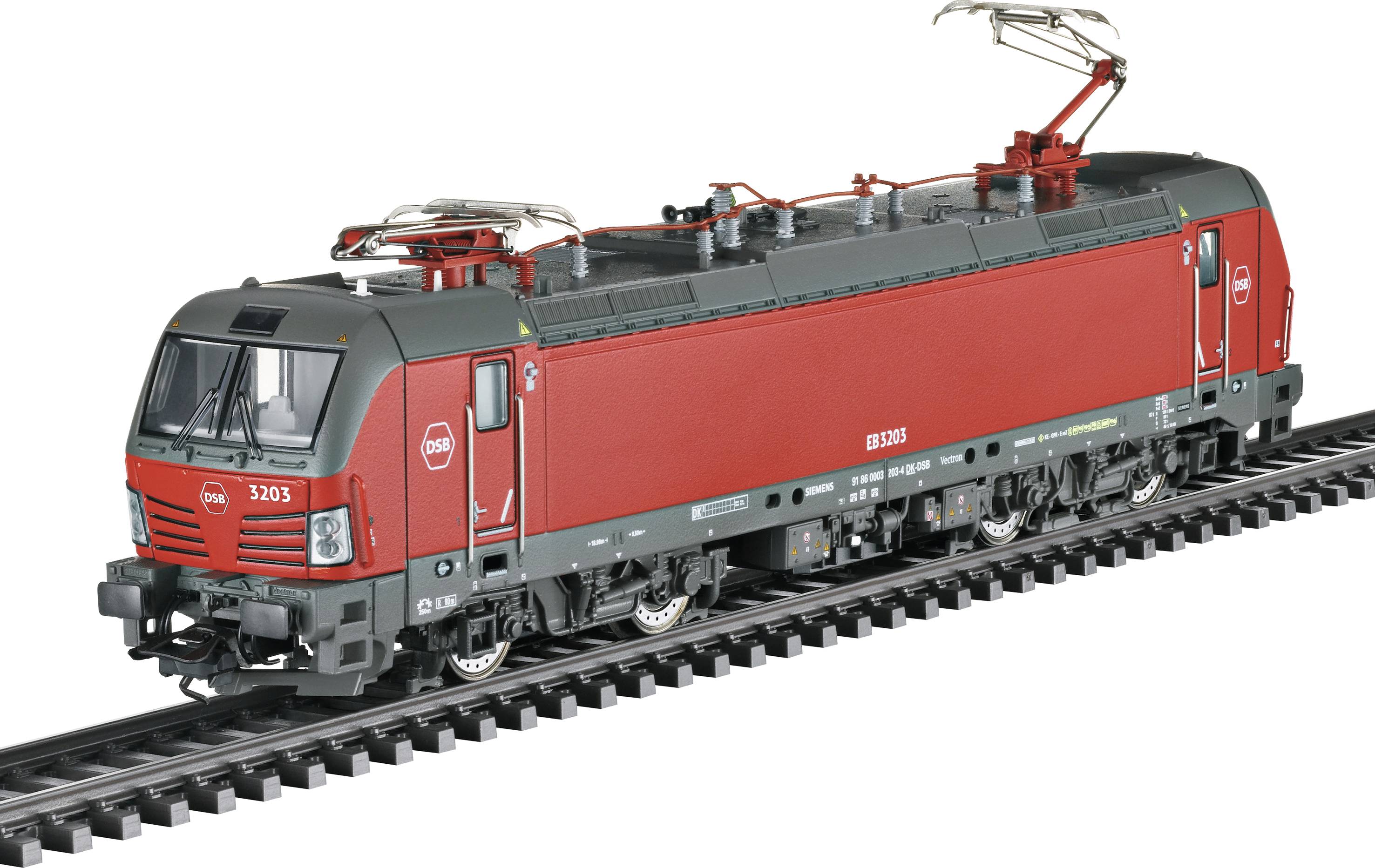 Red electric locomotive of the DDB on tracks, side view.