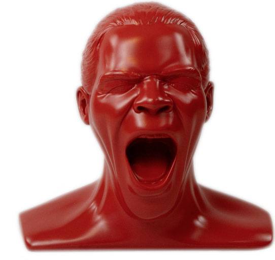 A red sculpture of a screaming face with a wide-open mouth, an aggressive expression.