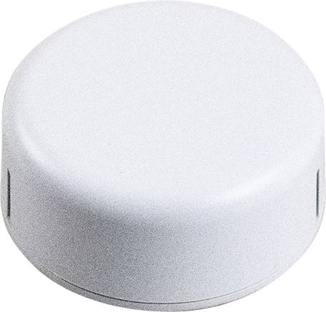 A round, white plastic lid with a smooth surface and small slots on the sides.