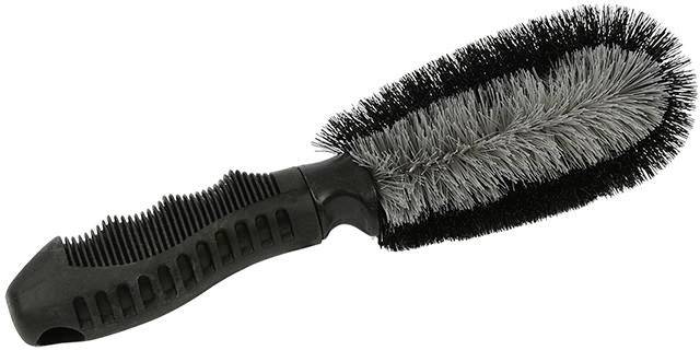 Black cleaning brush with ergonomic handle and dense bristles. Ideal for thorough cleaning of surfaces or vehicle parts.