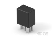 A black, rectangular electronic component with three metal terminals, standing on a light surface.