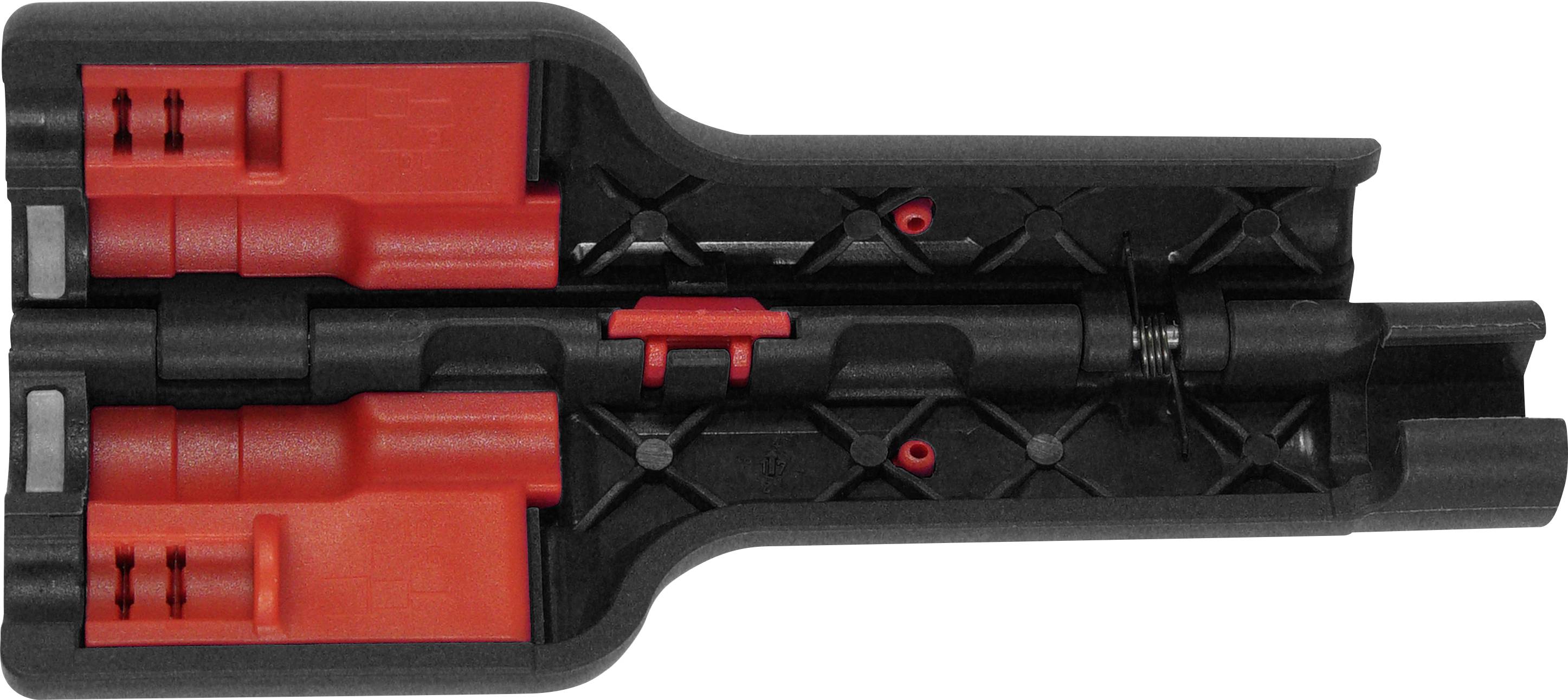 A red and black plastic tool with a central mechanism and multiple built-in components. Primarily technical equipment.