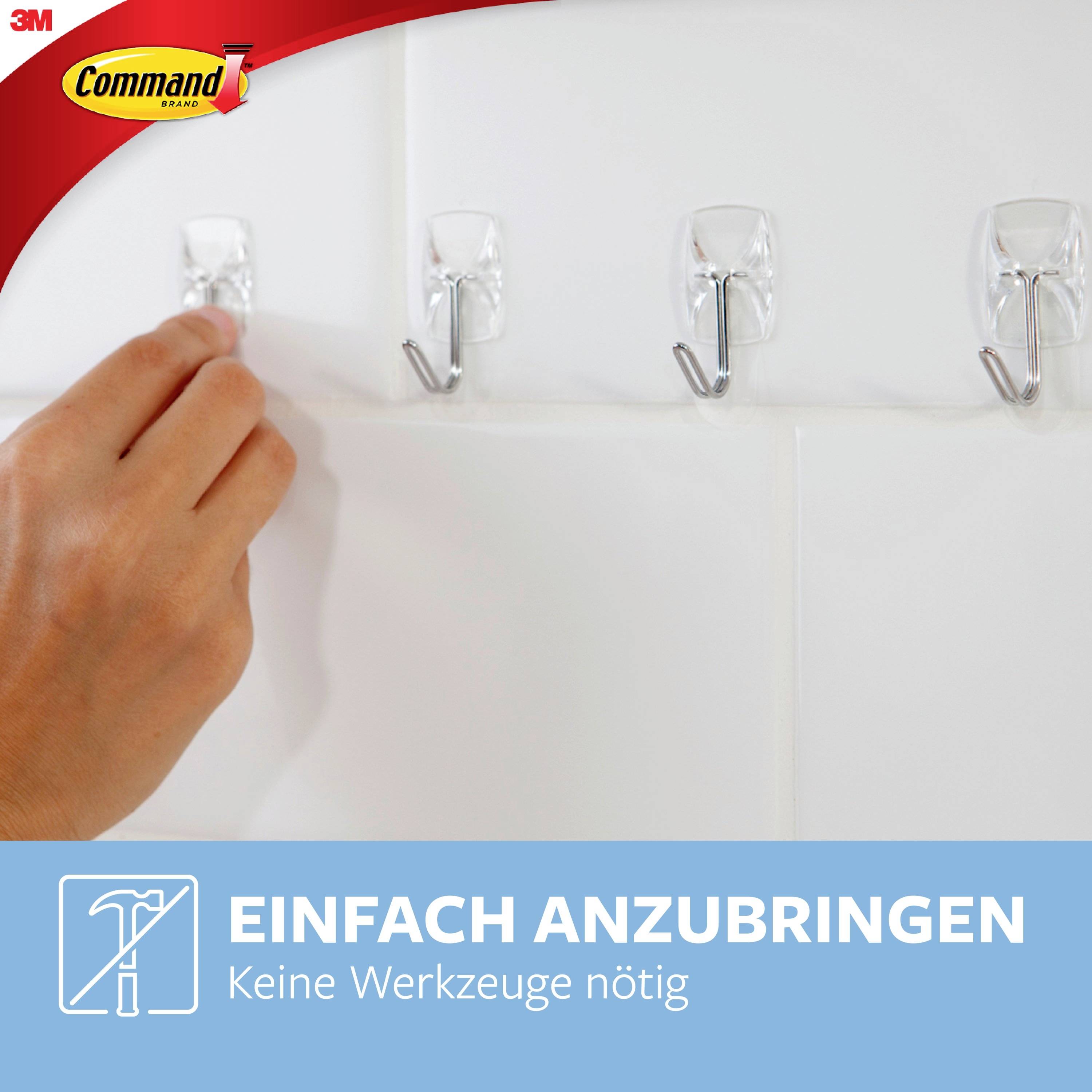 Hand mounting a transparent hook on a white tiled wall. Text: 'Easy to attach. No tools required.'