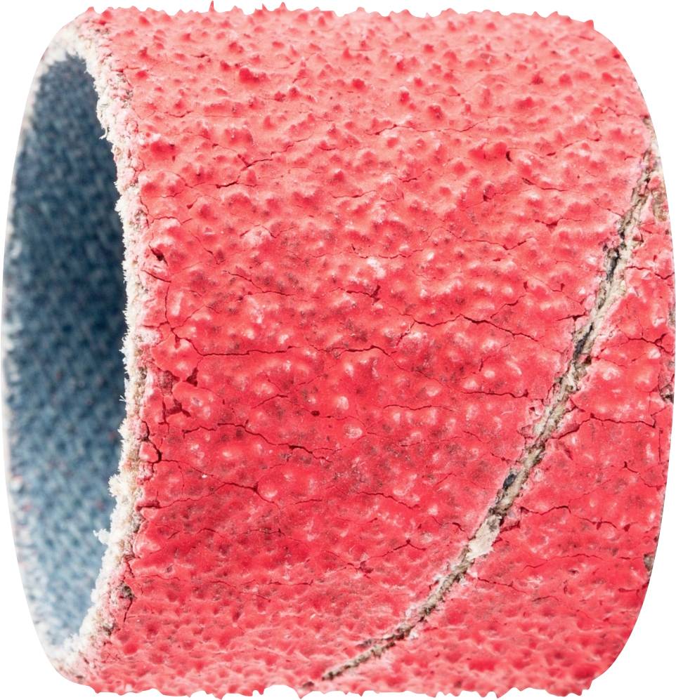 A red structured pipe, potentially for use in industry or construction, shows a rough, uneven surface.