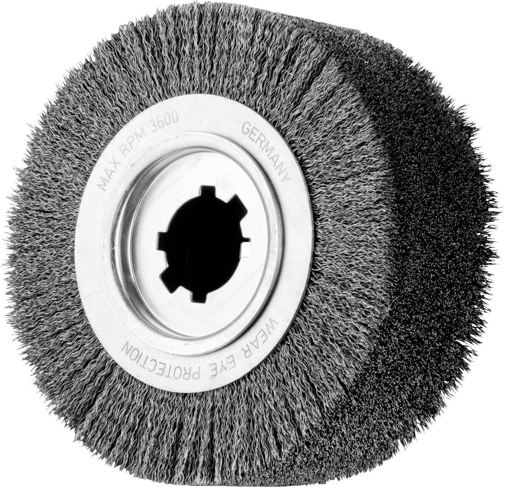Wire brush wheel with indication 'MAX RPM 3600' and 'WEAR EYE PROTECTION'; used for metalworking.