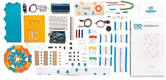 'Arduino Starter Kit' with circuit boards, resistors, LEDs, switches and sensors. Ideal for electronics and programming projects.