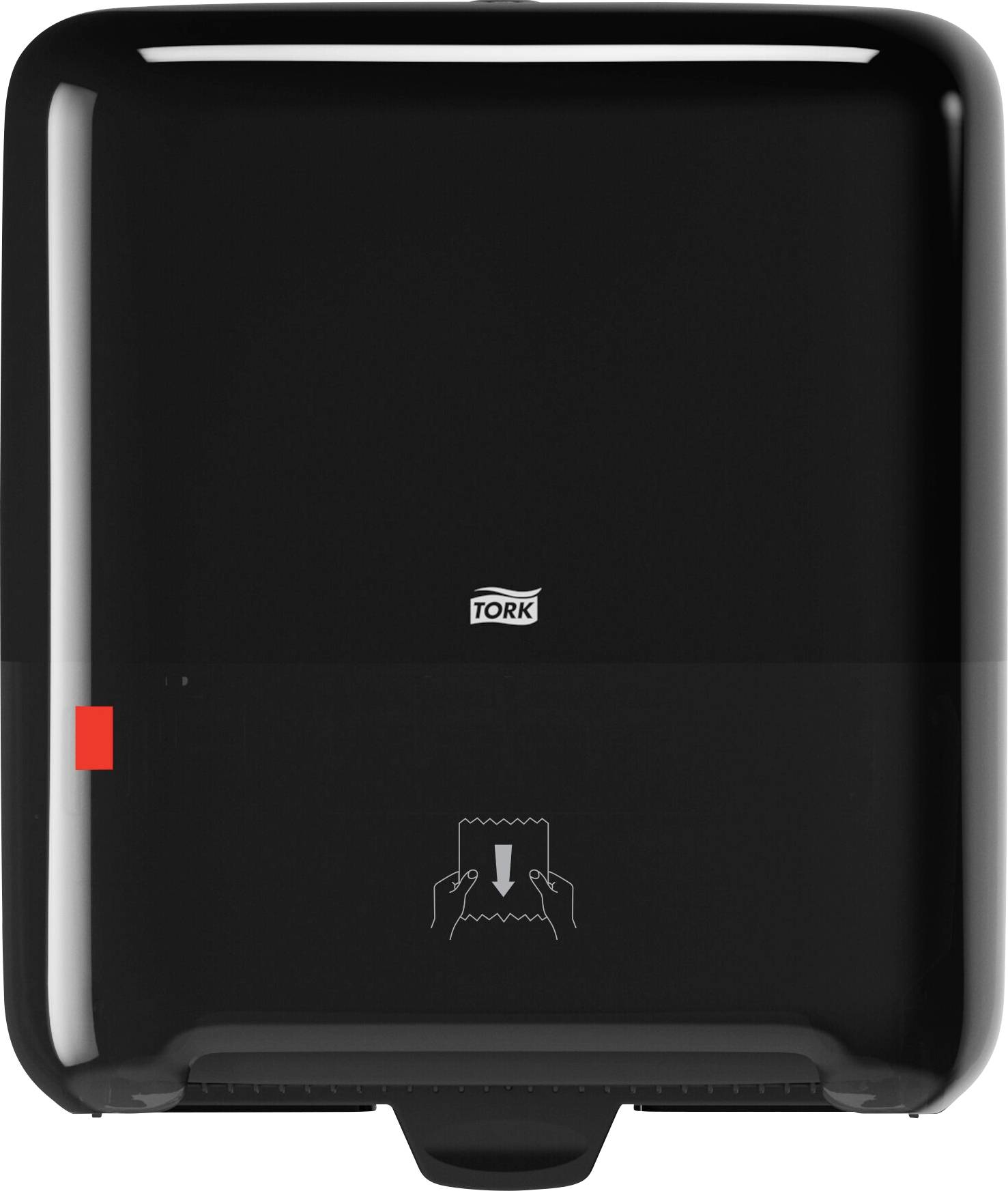 A black Tork paper towel dispenser mounted on the wall, with a pictogram at the bottom indicating how to pull the paper.