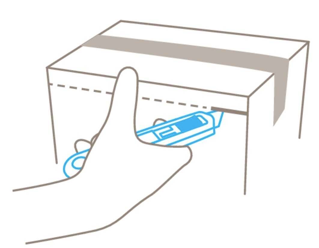 A hand inserts a sharp cutting tool into a cardboard sleeve to open the sealed package along the dotted line.