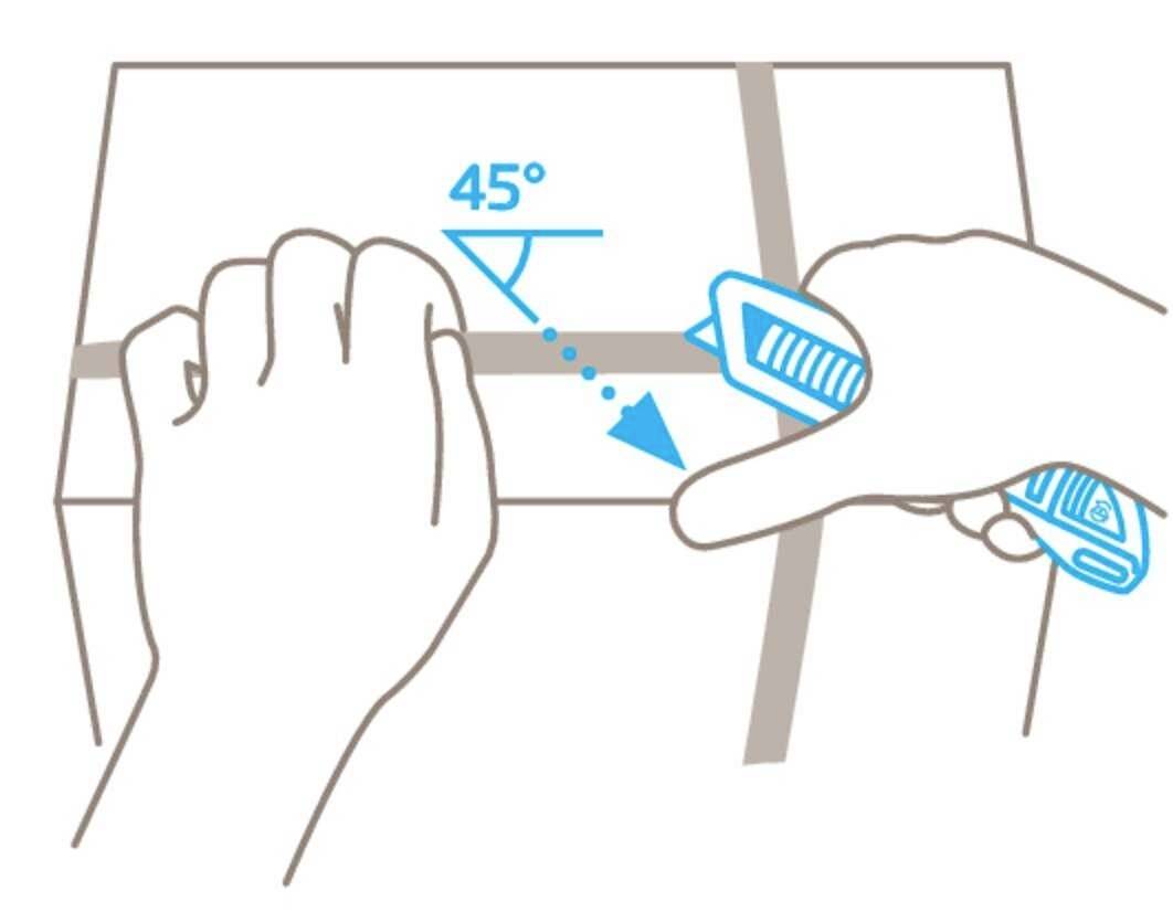 A hand is cutting packing tape at a 45-degree angle using a knife on a cardboard box to open the package.