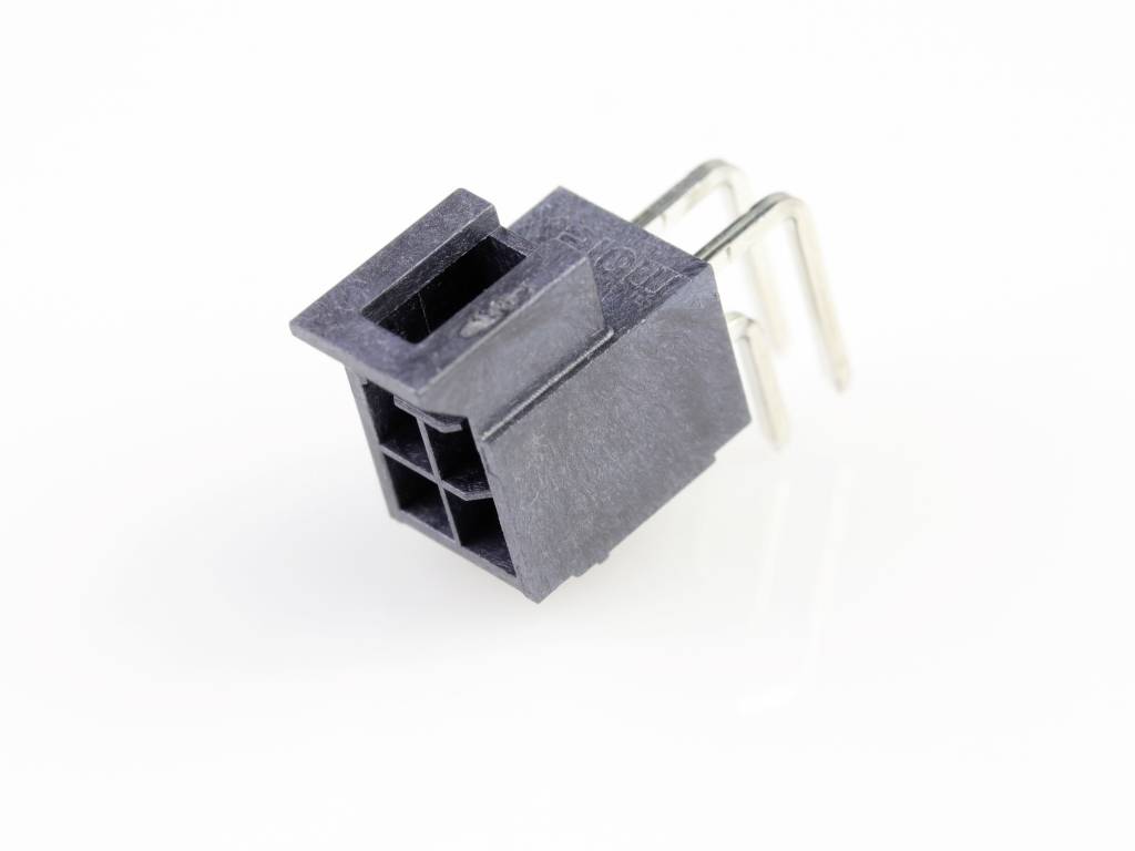 Black plastic plug with four square pins, pointing upwards and positioned sideways, on a white background.