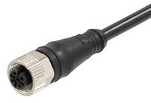Close-up of a black cable with a cylindrical plug and a metallic-like, ridged edge.