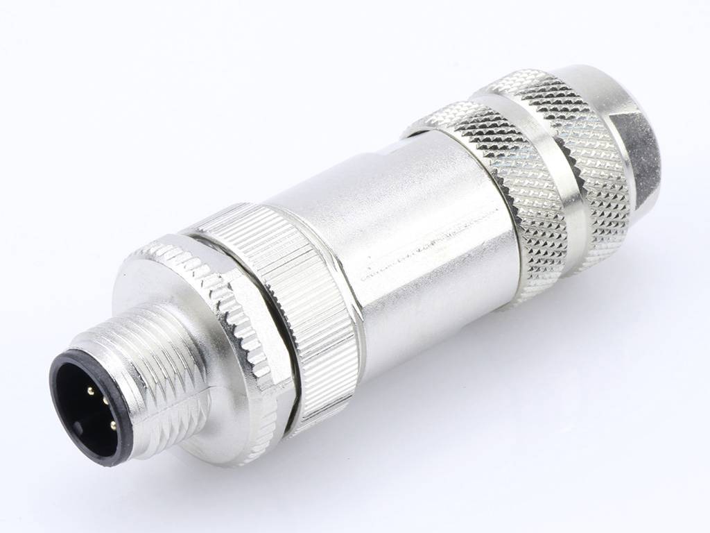 Silver circular multi-pin connector with a knurled grip, lying on a light background.