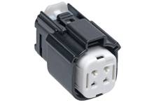 A black and white electrical plug with four holes, suitable for technical connections.