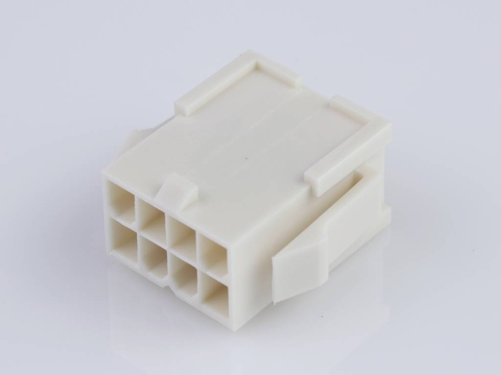 A white plastic plug with nine square socket slots. The plug is rectangular and is shown on a white surface.