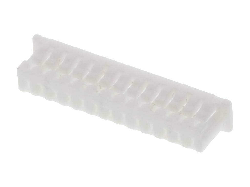 A white, rectangular plastic plug with multiple pins, lying on a flat surface, serves as an electrical connector.