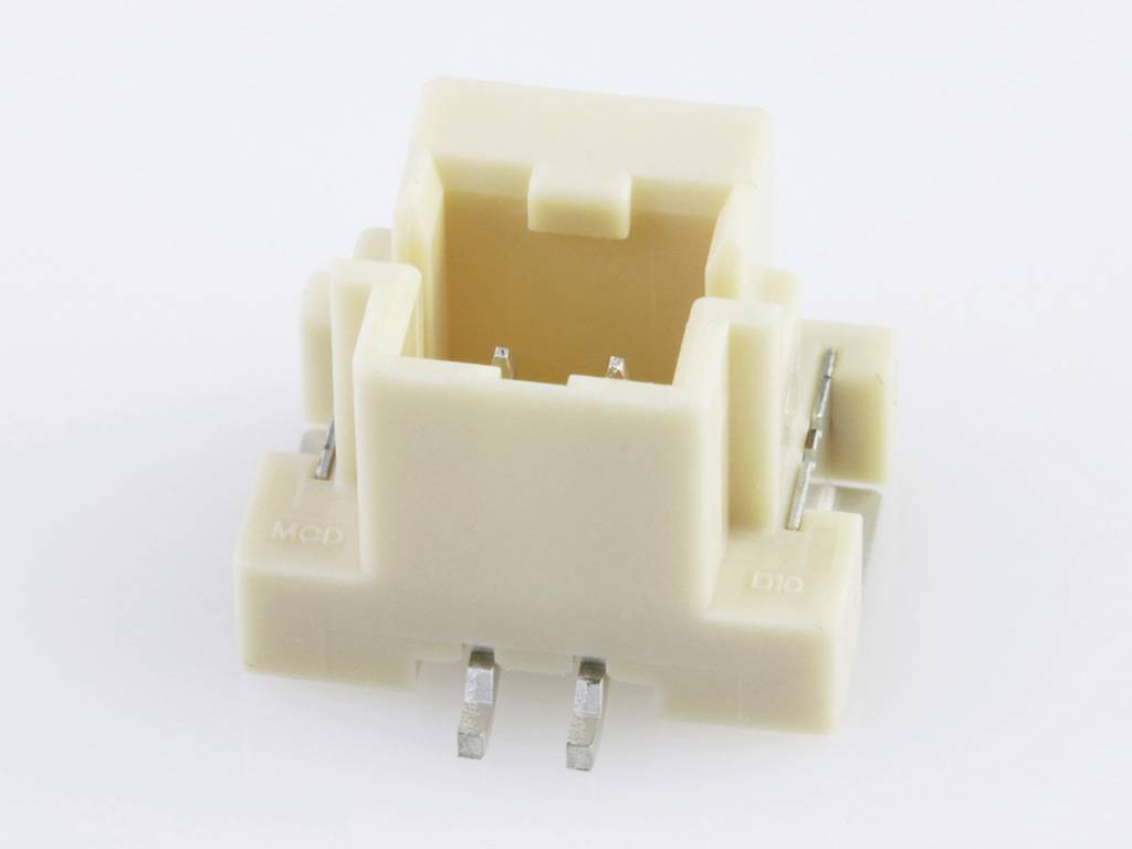A cream-coloured mechanical key switch without a keycap, shown from the side, with pins for mounting on a circuit board.