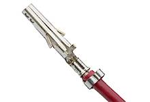 A metallic connector with a red cable, used for electrical connections in automotive applications.