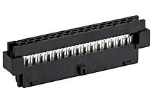 Black electric plug with multiple metal terminals.