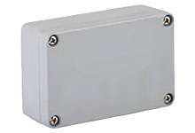 Grey rectangular housing with rounded edges and four screws at the corners.