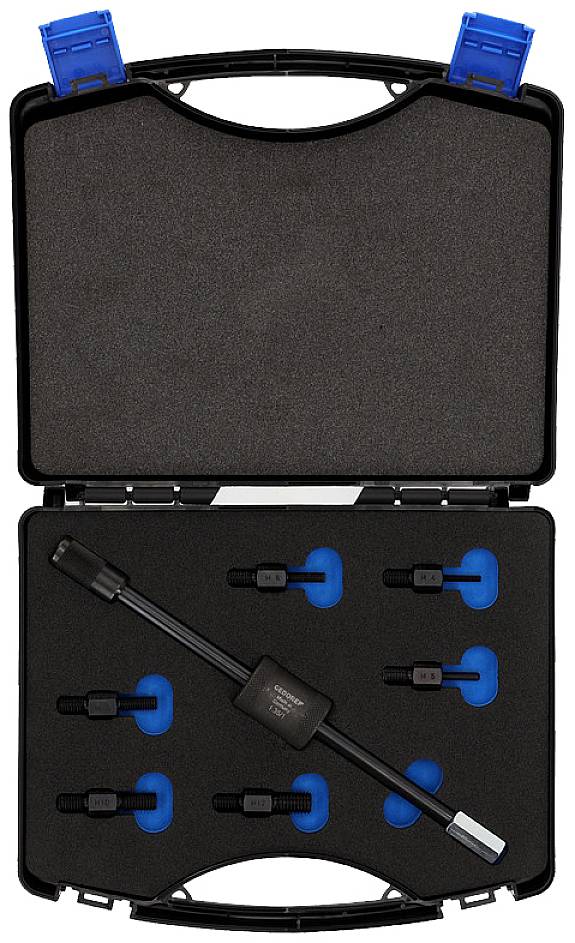 Open black case with foam lining, containing various black plugs and a long cable with a plug.