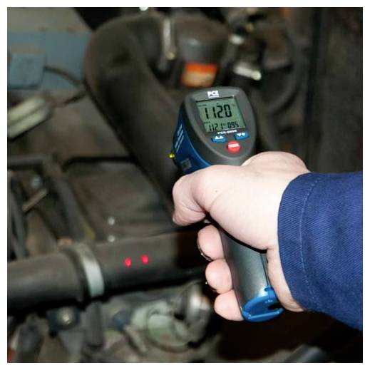 Handheld infrared thermometer aimed at engine components, showing a temperature reading of 112.7°F.