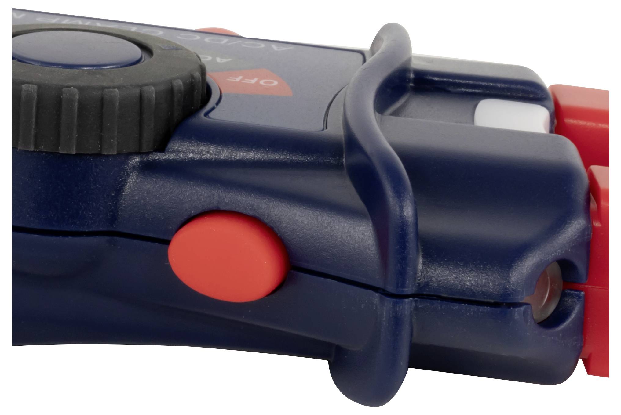 Close-up of a blue-and-red plastic flashlight or tool handle with a black ridged knob and red button, isolated on white.