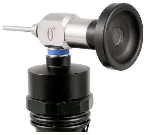 Close-up of a metal-and-black adjustable nozzle or sensor with a round side knob, mounted on a cylindrical fitting against a white background.