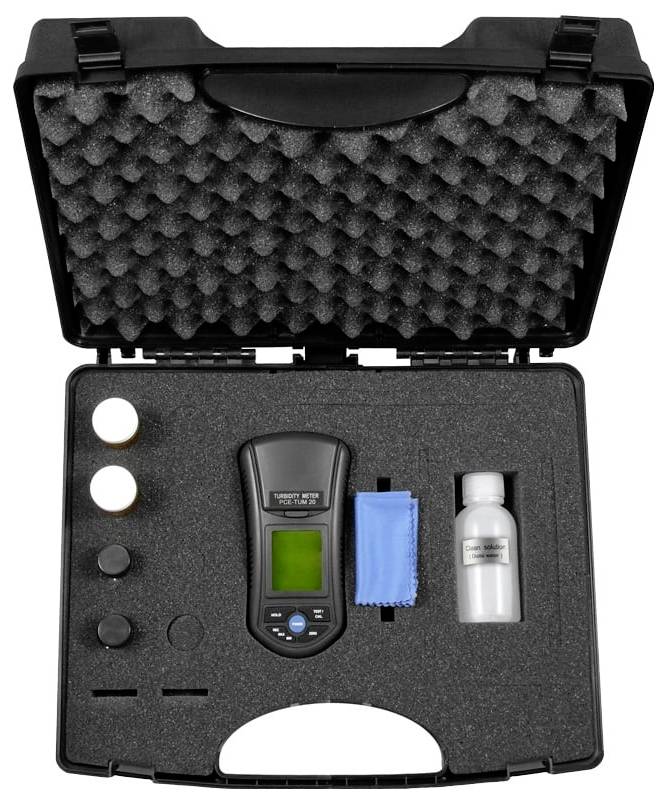 Open carrying case with foam insert holding a handheld digital meter, blue cloth, small bottle, and several round accessories.