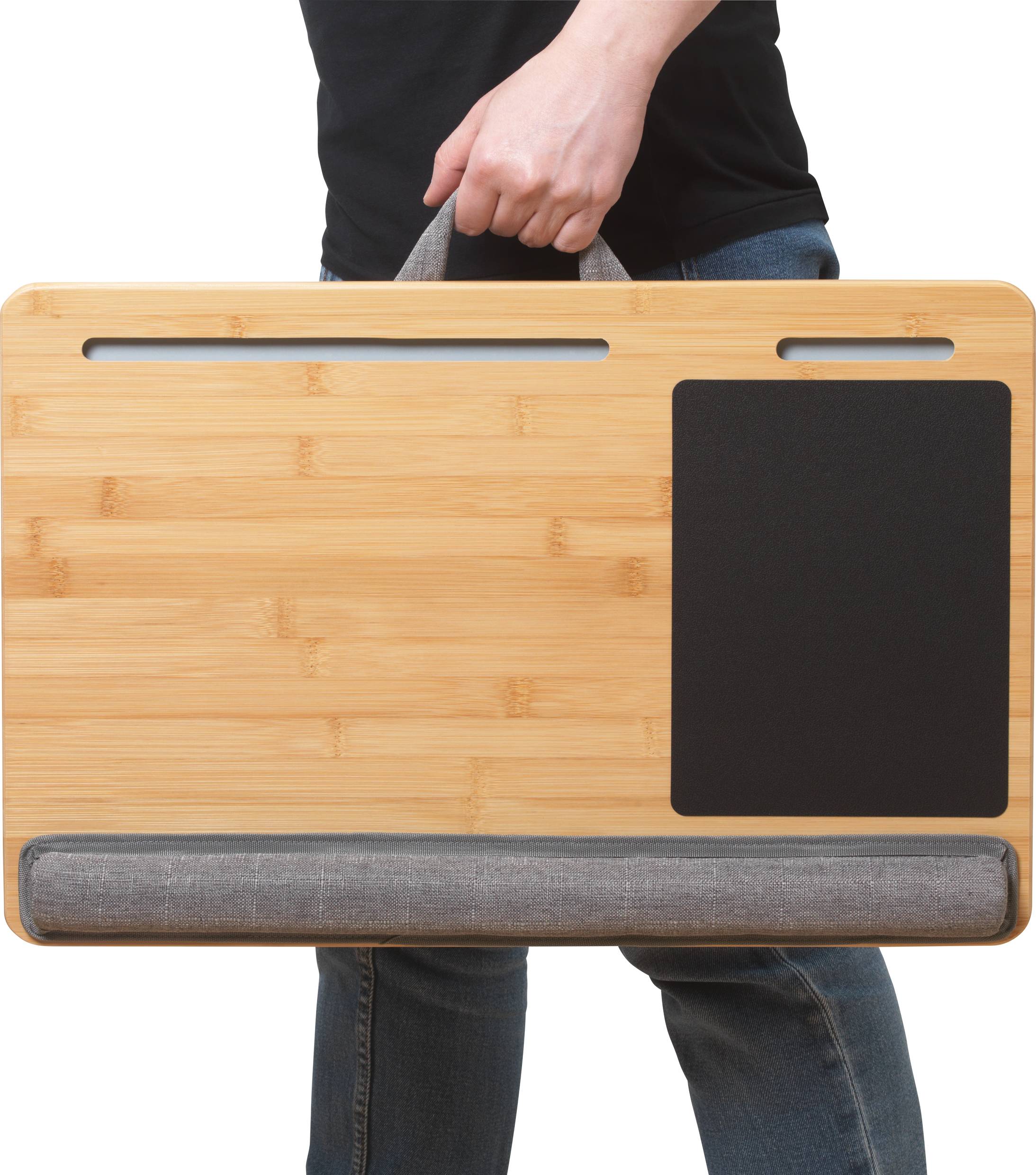 A person carries a portable bamboo laptop desk with a mouse pad, handle, and padded base. Ideal for comfortable laptop use while on the move.