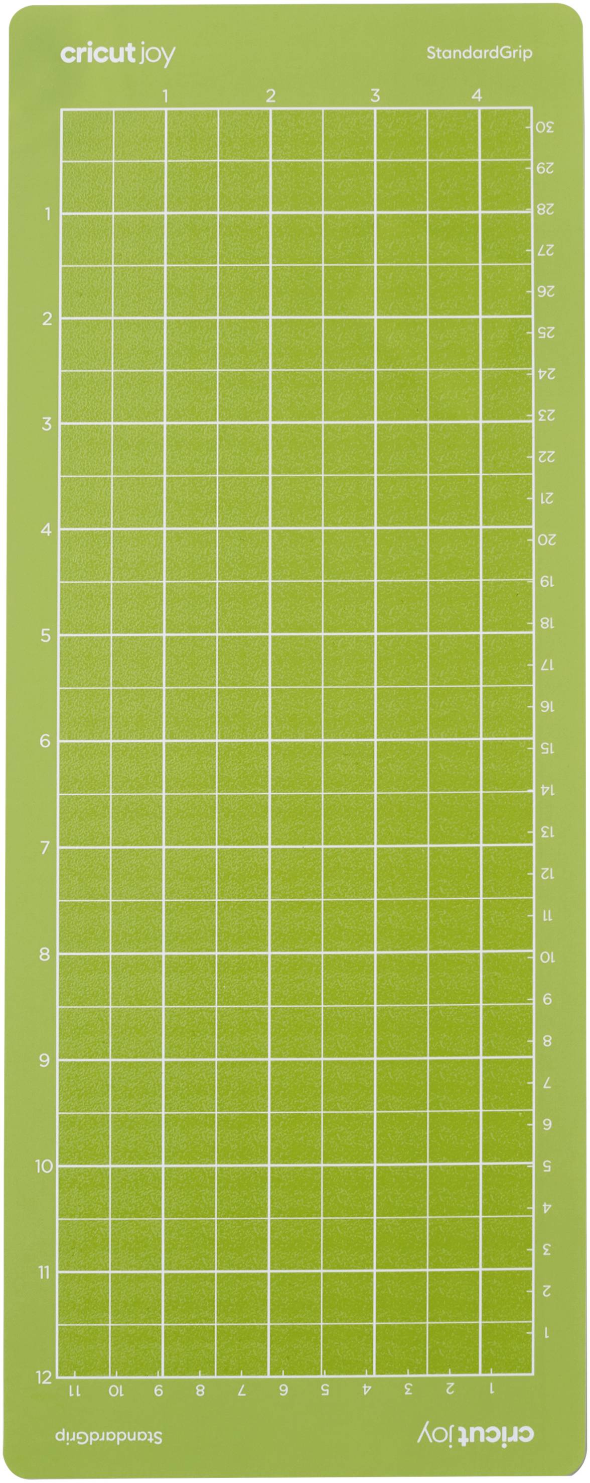Green cutting mat with grid pattern and numbered lines. 'Cricut Joy' logo in the top right corner.