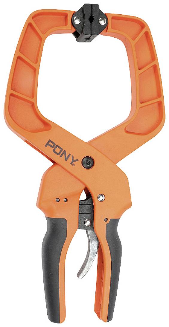 Orange plastic clip with black handle and spring mechanism. Inscription 'PONY'.